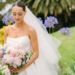 A beautiful bride wearing elegant 2026 bridal makeup with glowing skin, soft eye makeup, nude lips, and a stylish wedding hairstyle.