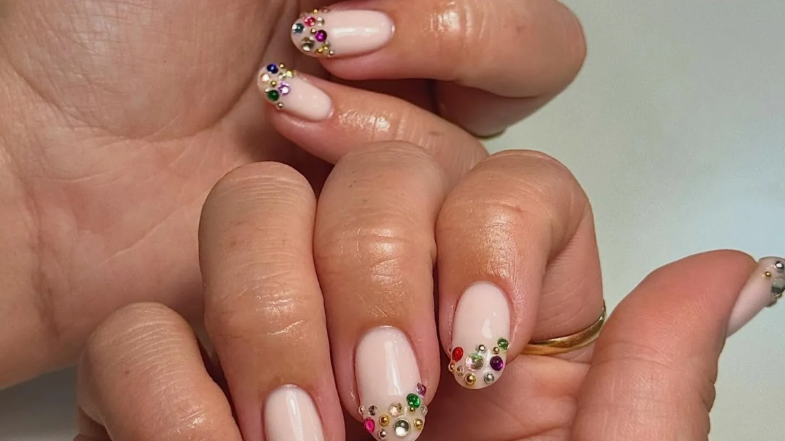 Chic nail trends 2026 featuring elegant nail designs, French tips, chrome, nude, pastel, floral, and glossy nail styles.