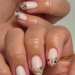 Chic nail trends 2026 featuring elegant nail designs, French tips, chrome, nude, pastel, floral, and glossy nail styles.